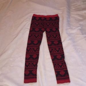 Dark red “faded glory” leggings with red design.